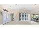 Living room with built in shelving and access to backyard at 521 Pennyroyal Pl, Venice, FL 34293