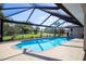 Inviting screened pool with ample surrounding patio space at 521 Pennyroyal Pl, Venice, FL 34293