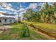 Backyard with grassy area and a canal at 552 Fleetwood St, North Port, FL 34287