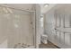 Bathroom with a shower, toilet, and wood flooring at 552 Fleetwood St, North Port, FL 34287
