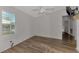 Bedroom with ceiling fan, window shutters and wood-look flooring at 552 Fleetwood St, North Port, FL 34287