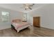 Comfortable bedroom with a queen-size bed and wood flooring at 552 Fleetwood St, North Port, FL 34287
