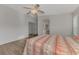 Main bedroom with a queen bed and ensuite bathroom access at 552 Fleetwood St, North Port, FL 34287