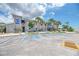 Community clubhouse with parking and landscaping at 552 Fleetwood St, North Port, FL 34287