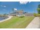 Community clubhouse with water access and landscaping at 552 Fleetwood St, North Port, FL 34287