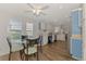 Casual dining area with glass-top table and chairs near kitchen at 552 Fleetwood St, North Port, FL 34287