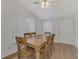 Bright dining room featuring a wooden table with four chairs and wood flooring at 552 Fleetwood St, North Port, FL 34287