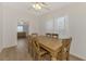 Simple dining room with a large wooden table and six chairs at 552 Fleetwood St, North Port, FL 34287