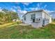 White single-wide mobile home with a grassy yard at 552 Fleetwood St, North Port, FL 34287