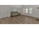 Spacious living room with hardwood floors and recessed lighting at 552 Fleetwood St, North Port, FL 34287
