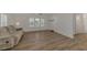 Living room featuring hardwood floors and a couch at 552 Fleetwood St, North Port, FL 34287
