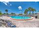 Inviting community pool with plenty of lounge chairs at 552 Fleetwood St, North Port, FL 34287