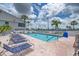 Inviting community pool with lounge chairs and a refreshing blue water at 552 Fleetwood St, North Port, FL 34287