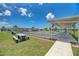 Community shuffleboard courts with covered seating at 552 Fleetwood St, North Port, FL 34287