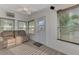 Sunroom with a couch, ceiling fan, and access to the outdoors at 552 Fleetwood St, North Port, FL 34287