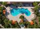 Aerial view of resort-style pool with surrounding lounge chairs at 5592 Semolino St, Nokomis, FL 34275