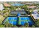 Tennis and pickleball courts with lake view at 5592 Semolino St, Nokomis, FL 34275