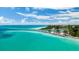 Stunning aerial view of a beach with clear water at 5592 Semolino St, Nokomis, FL 34275