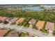 Community overview featuring lake and luxury homes at 5592 Semolino St, Nokomis, FL 34275