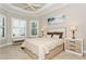 Bright bedroom with a comfortable bed and window seating at 5592 Semolino St, Nokomis, FL 34275