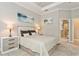 Spacious bedroom with light color walls and wood-like nightstands at 5592 Semolino St, Nokomis, FL 34275