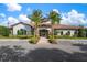 Community clubhouse with welcoming entrance and landscaping at 5592 Semolino St, Nokomis, FL 34275