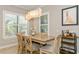 Casual dining area with a wooden table and bar cart at 5592 Semolino St, Nokomis, FL 34275