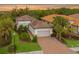 Beautiful one-story home with a tile roof and landscaped yard at 5592 Semolino St, Nokomis, FL 34275
