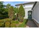 Landscaped entry with lush greenery and a brick walkway at 5592 Semolino St, Nokomis, FL 34275