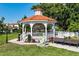 Quaint gazebo with seating and mermaid statue, located in a park-like setting at 5592 Semolino St, Nokomis, FL 34275