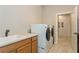 Laundry room with washer, dryer, and utility sink at 5592 Semolino St, Nokomis, FL 34275
