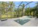 Relaxing pool and spa area with covered lanai at 5592 Semolino St, Nokomis, FL 34275