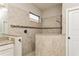 Large walk-in shower with multiple shower heads and tile surround at 5592 Semolino St, Nokomis, FL 34275