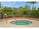 Community hot tub with surrounding landscaping at 5592 Semolino St, Nokomis, FL 34275