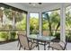 Bright sunroom with glass enclosure and outdoor views at 5592 Semolino St, Nokomis, FL 34275