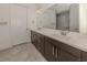 Double vanity bathroom with large mirror and shower at 5733 Semolino St, Nokomis, FL 34275