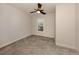 Small bedroom with tile floor and window shutters at 5733 Semolino St, Nokomis, FL 34275