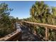 Wooden boardwalk path through lush landscape at 5733 Semolino St, Nokomis, FL 34275