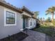 Front entrance with teal door and pathway at 5733 Semolino St, Nokomis, FL 34275
