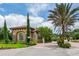 Gated community entrance with guard house and landscaping at 5733 Semolino St, Nokomis, FL 34275