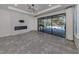 Bright living room with fireplace and sliding glass doors leading to the pool at 5733 Semolino St, Nokomis, FL 34275