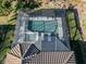 Aerial view of a screened pool and spa at 5733 Semolino St, Nokomis, FL 34275