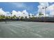 Full-size lighted tennis court with net and fencing at 5733 Semolino St, Nokomis, FL 34275