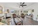 Spacious living room with recliner chairs and a large window at 6228 Country Club Way, Sarasota, FL 34243