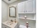 Clean bathroom with white cabinets and a vessel sink at 649 Tamiami S Trl # 107, Venice, FL 34285