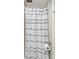 Bathroom with shower and wave patterned shower curtain at 649 Tamiami S Trl # 107, Venice, FL 34285
