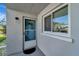 Condo entry with screen door and window at 649 Tamiami S Trl # 107, Venice, FL 34285