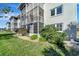 Building exterior showcasing well-maintained landscaping at 649 Tamiami S Trl # 107, Venice, FL 34285