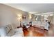 Living room featuring comfortable seating and wood floors at 649 Tamiami S Trl # 107, Venice, FL 34285