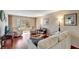 Living room with sofas, chairs, and access to patio at 649 Tamiami S Trl # 107, Venice, FL 34285